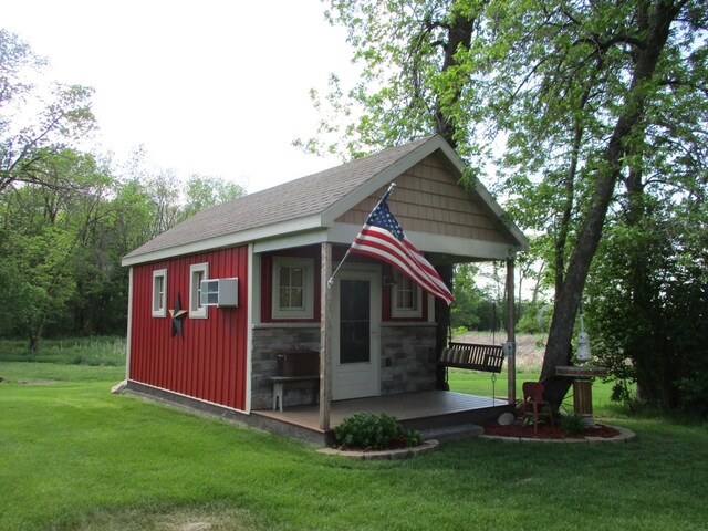 8300 263rd St, Saint Cloud, MN 56301 - view of outbuilding featuring an outdoor structure and a wall mounted air conditioner