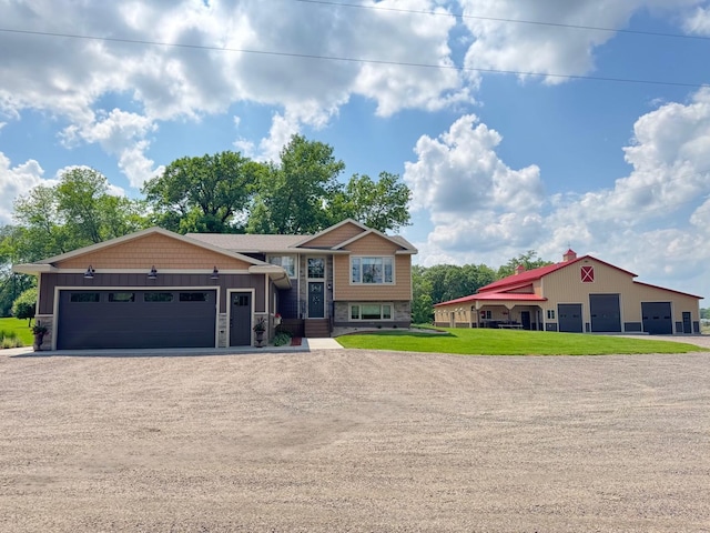 8300 263rd St, Saint Cloud, MN 56301 - view of front of house featuring driveway, a garage, and a front lawn