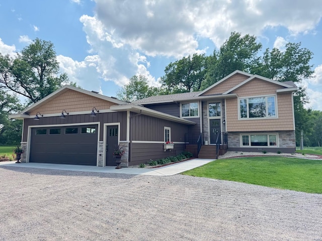 8300 263rd St, Saint Cloud, MN 56301 - raised ranch featuring stone siding, driveway, an attached garage, a front yard, and board and batten siding