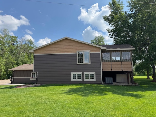 8300 263rd St, Saint Cloud, MN 56301 - back of house with a lawn and central AC