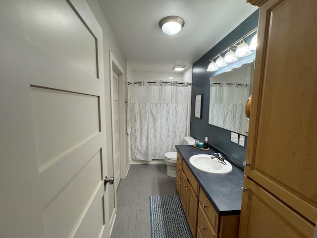 8300 263rd St, Saint Cloud, MN 56301 - bathroom with vanity, toilet, and tile patterned floors
