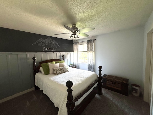 8300 263rd St, Saint Cloud, MN 56301 - bedroom featuring carpet floors, a textured ceiling, ceiling fan, and a wainscoted wall