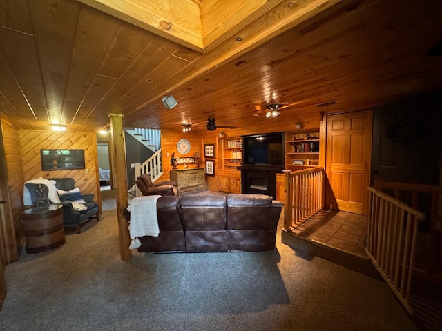 8300 263rd St, Saint Cloud, MN 56301 - carpeted living area with wood walls, wooden ceiling, and built in features