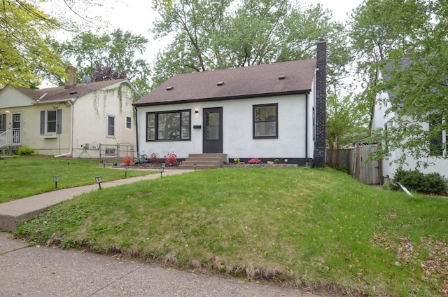 1459 Maywood St, Saint Paul, MN 55117 - view of front facade featuring a chimney and roof with shingles