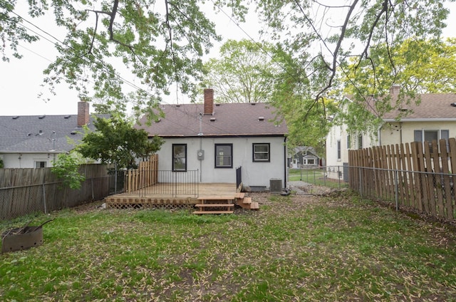 1459 Maywood St, Saint Paul, MN 55117 - rear view of house featuring a wooden deck, a chimney, stucco siding, and cooling unit