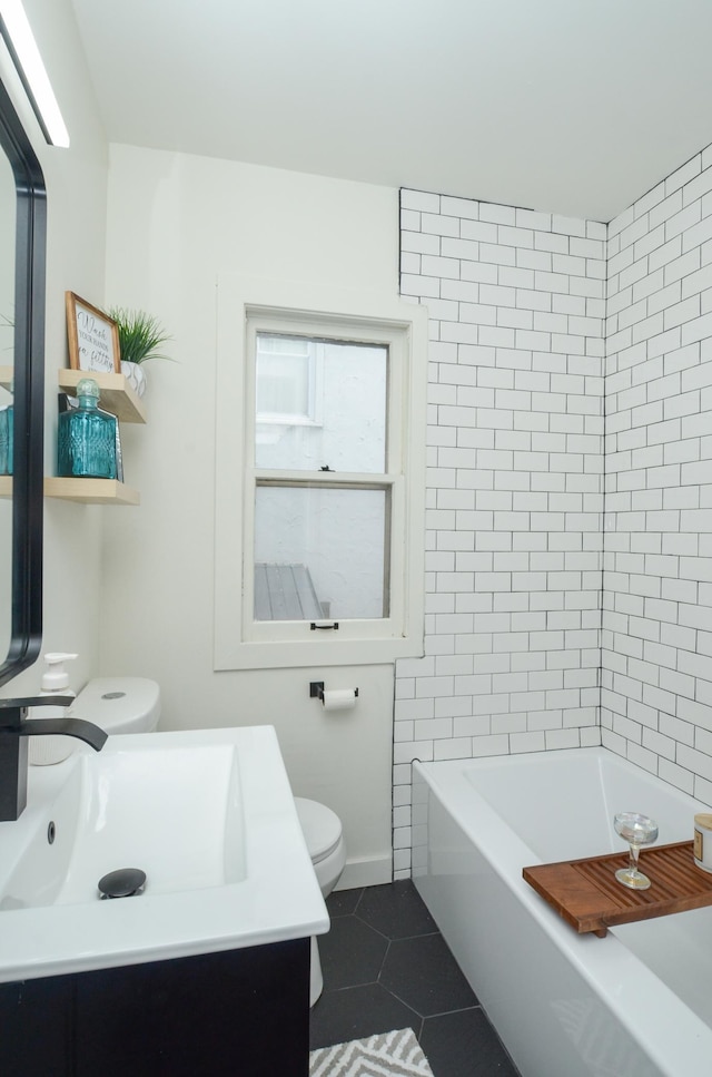 1459 Maywood St, Saint Paul, MN 55117 - bathroom featuring toilet, tile patterned floors, a tub, and vanity