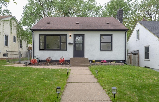 1459 Maywood St, Saint Paul, MN 55117 - view of front facade featuring entry steps, roof with shingles, a chimney, and a gate