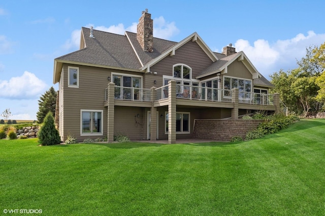 23380 127th St, Glenwood, MN 56334 - rear view of property with a chimney, a yard, and roof with shingles