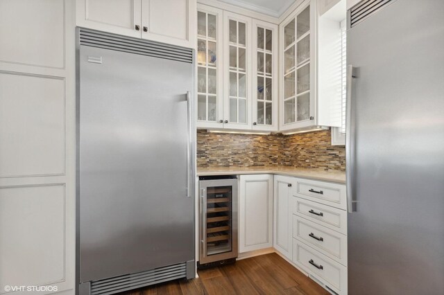 23380 127th St, Glenwood, MN 56334 - kitchen with stainless steel built in refrigerator, beverage cooler, high end fridge, light countertops, and decorative backsplash