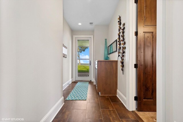 23380 127th St, Glenwood, MN 56334 - doorway to outside with baseboards, dark wood-type flooring, and recessed lighting