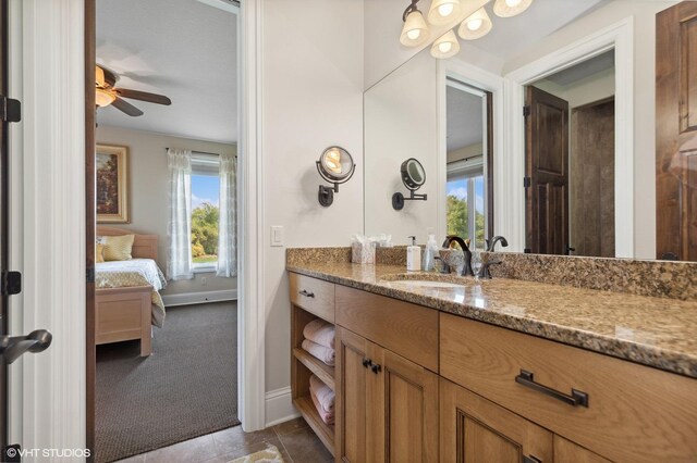23380 127th St, Glenwood, MN 56334 - bathroom featuring ensuite bath, vanity, a ceiling fan, baseboards, and tile patterned floors