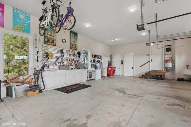 23380 127th St, Glenwood, MN 56334 - garage with a garage door opener and a workshop area