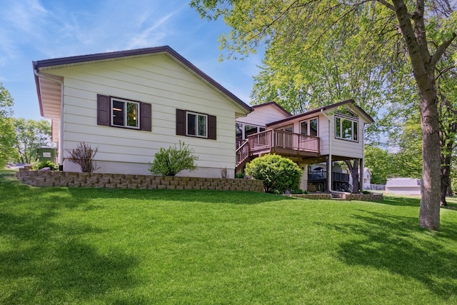 13073 Eldorado St NE, Blaine, MN 55449 - view of front of home featuring a wooden deck and a front yard