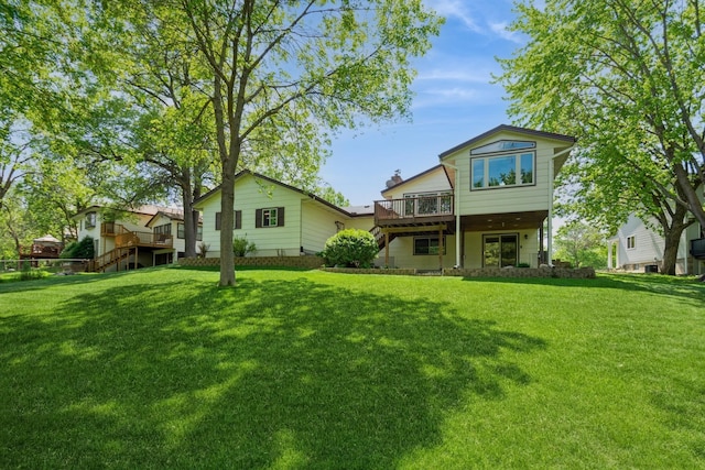 13073 Eldorado St NE, Blaine, MN 55449 - rear view of house featuring a deck, a yard, and stairs