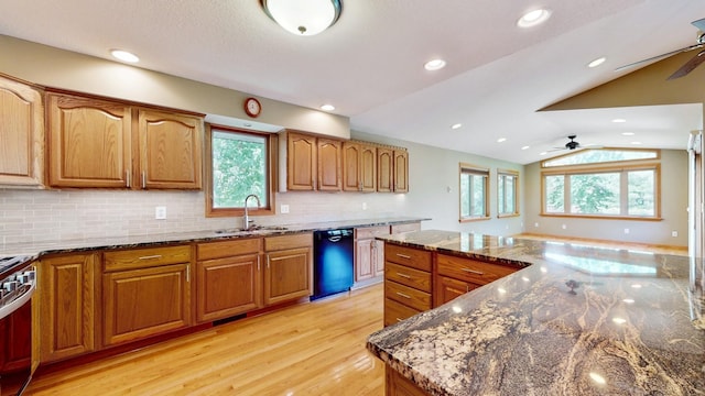 13073 Eldorado St NE, Blaine, MN 55449 - kitchen with a sink, a ceiling fan, black dishwasher, brown cabinetry, and lofted ceiling