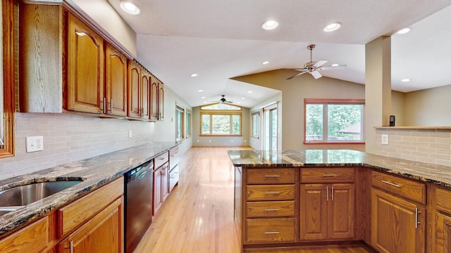 13073 Eldorado St NE, Blaine, MN 55449 - kitchen featuring dishwashing machine, ceiling fan, vaulted ceiling, light wood-style flooring, and brown cabinets