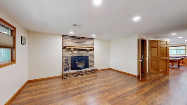 13073 Eldorado St NE, Blaine, MN 55449 - unfurnished living room featuring hardwood / wood-style flooring, recessed lighting, and baseboards