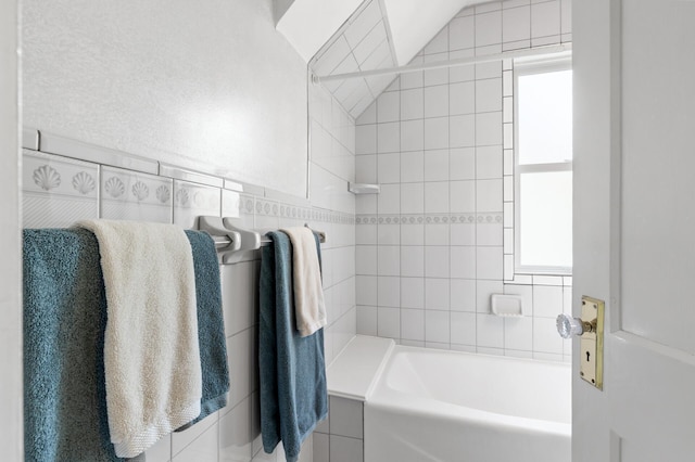 bathroom with a bath and a shower