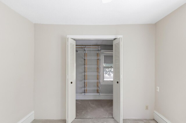 closet featuring baseboard heating