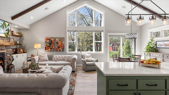 2356 Laport Dr, Mounds View, MN 55112 - living room with high vaulted ceiling, wood finished floors, beam ceiling, a fireplace, and recessed lighting