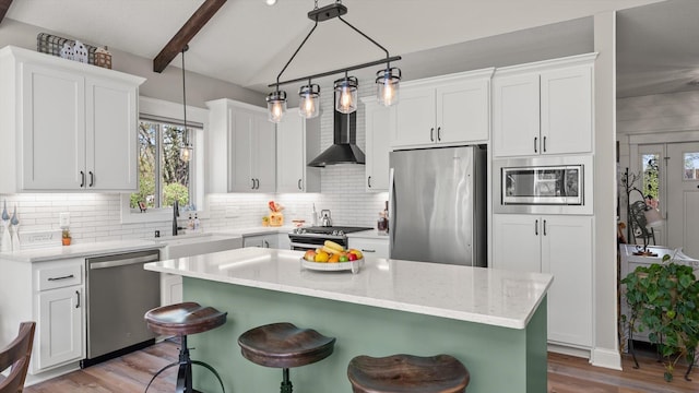 2356 Laport Dr, Mounds View, MN 55112 - kitchen featuring stainless steel appliances, plenty of natural light, backsplash, and a breakfast bar