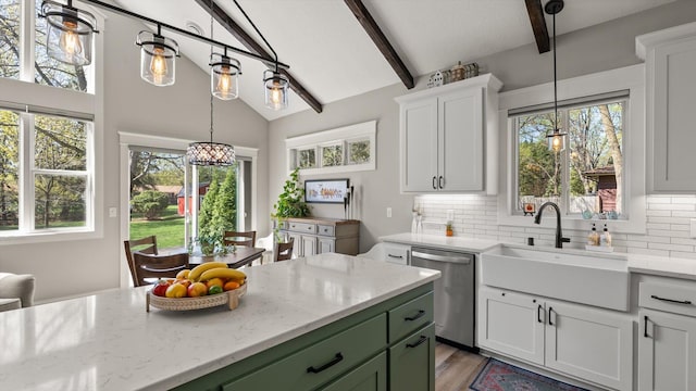 2356 Laport Dr, Mounds View, MN 55112 - kitchen with stainless steel dishwasher, a sink, green cabinets, and plenty of natural light