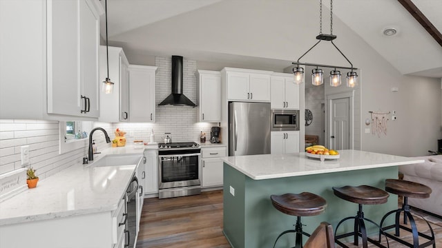 2356 Laport Dr, Mounds View, MN 55112 - kitchen with wall chimney exhaust hood, appliances with stainless steel finishes, a sink, lofted ceiling, and backsplash