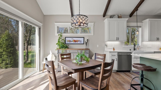 2356 Laport Dr, Mounds View, MN 55112 - dining area with plenty of natural light, a chandelier, and light wood-style floors