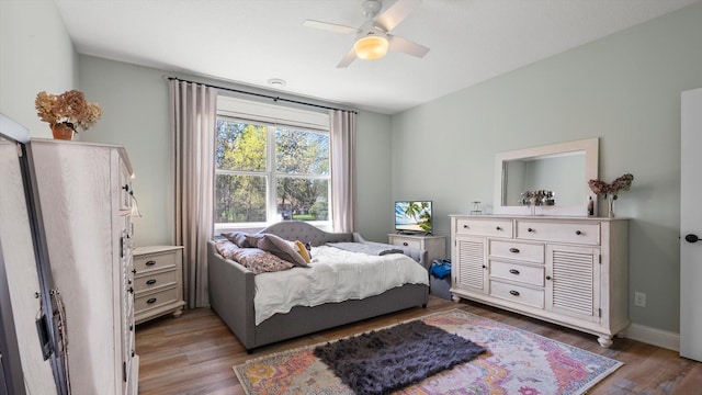2356 Laport Dr, Mounds View, MN 55112 - bedroom with light wood-style floors, baseboards, and a ceiling fan