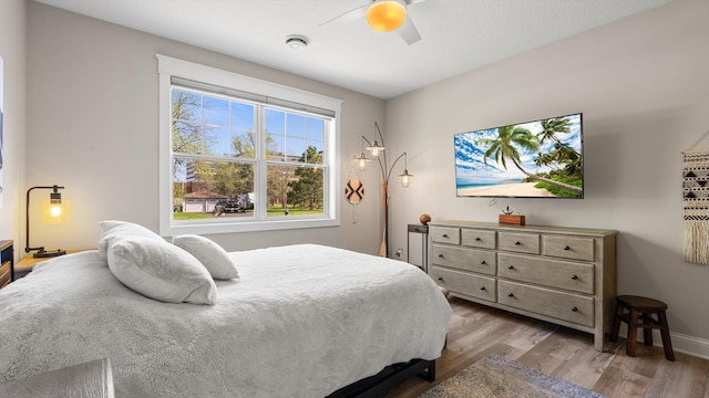 2356 Laport Dr, Mounds View, MN 55112 - bedroom featuring wood finished floors, a ceiling fan, and baseboards