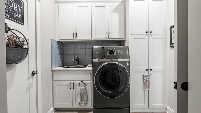 2356 Laport Dr, Mounds View, MN 55112 - laundry room featuring washer / dryer, cabinet space, and baseboards