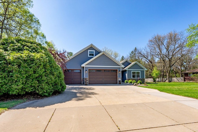 2356 Laport Dr, Mounds View, MN 55112 - craftsman-style house with driveway, stone siding, and a garage