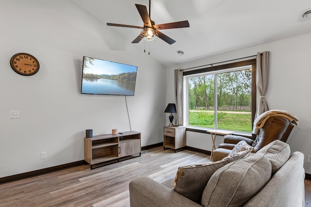 508 14th St NW, Waseca, MN 56093 - living room featuring lofted ceiling, light wood-style floors, a ceiling fan, and baseboards
