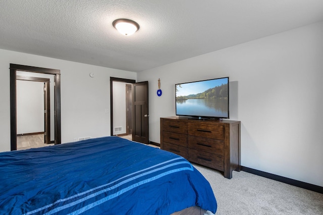 508 14th St NW, Waseca, MN 56093 - carpeted bedroom with baseboards and a textured ceiling
