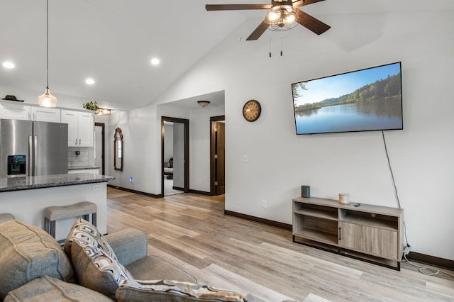 508 14th St NW, Waseca, MN 56093 - living area with a ceiling fan, baseboards, recessed lighting, light wood-style floors, and high vaulted ceiling