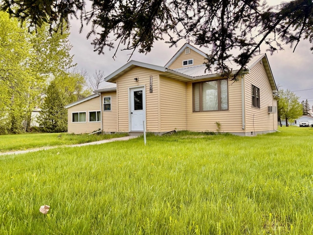 113 6th Ave SE, Baudette, MN 56623 - bungalow-style home with a front lawn and metal roof
