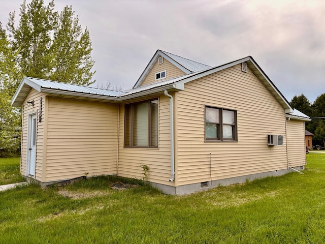 113 6th Ave SE, Baudette, MN 56623 - view of home's exterior with a lawn, metal roof, and crawl space