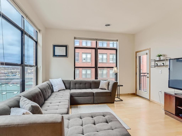270 4th St E Unit 402, Saint Paul, MN 55101 - living room with light wood-style floors, plenty of natural light, and baseboards