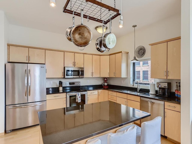 270 4th St E Unit 402, Saint Paul, MN 55101 - kitchen with stainless steel appliances, a sink, and light brown cabinetry