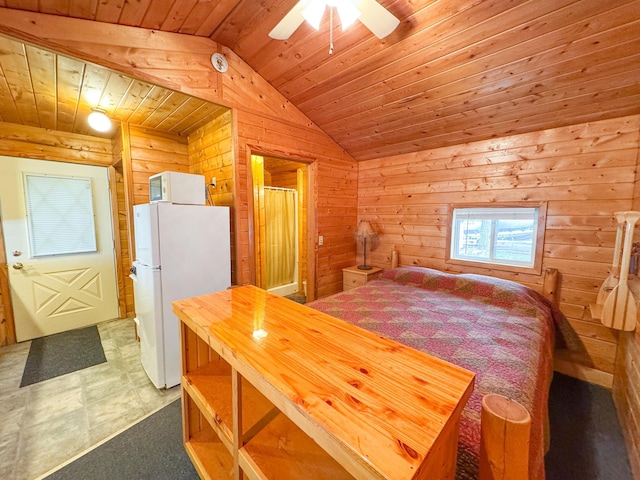 27621 83 Unit 2, Battle Lake, MN 56515 - bedroom with freestanding refrigerator, wood ceiling, vaulted ceiling, and wood walls