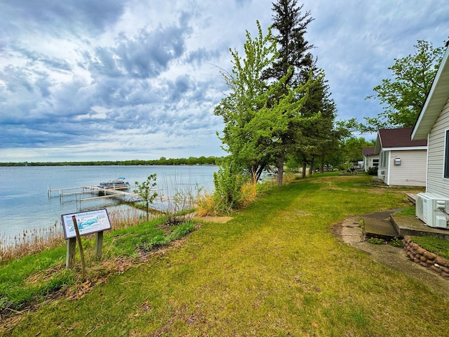 27621 83 Unit 2, Battle Lake, MN 56515 - view of grassy yard featuring a water view and a cooling unit