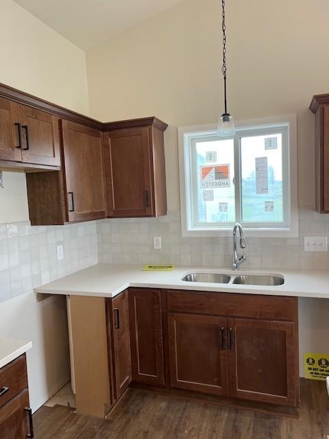 1483 Grand View Ln SE, Mazeppa, MN 55956 - kitchen featuring dark wood finished floors, tasteful backsplash, light countertops, and lofted ceiling
