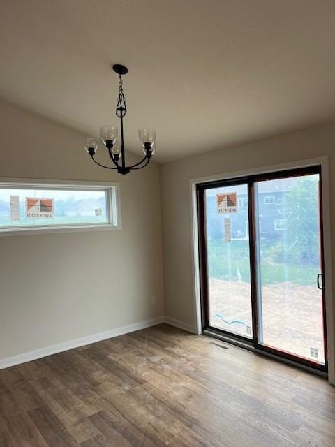 1483 Grand View Ln SE, Mazeppa, MN 55956 - unfurnished dining area featuring light wood-style floors and a chandelier