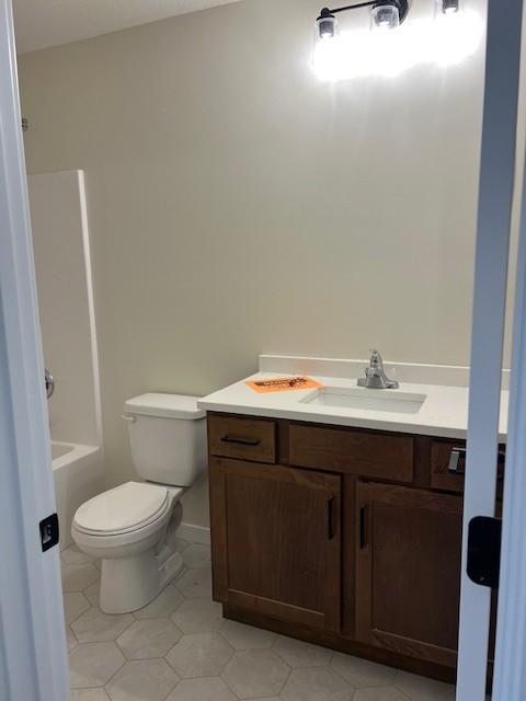 1483 Grand View Ln SE, Mazeppa, MN 55956 - bathroom with vanity, tile patterned floors, and bathing tub / shower combination