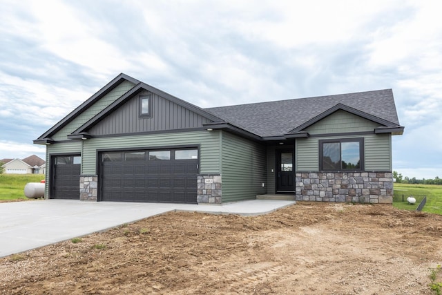 1483 Grand View Ln SE, Mazeppa, MN 55956 - craftsman inspired home featuring stone siding, an attached garage, concrete driveway, and roof with shingles