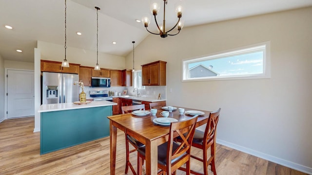 1483 Grand View Ln SE, Mazeppa, MN 55956 - dining space featuring light wood-type flooring, a chandelier, lofted ceiling, and recessed lighting