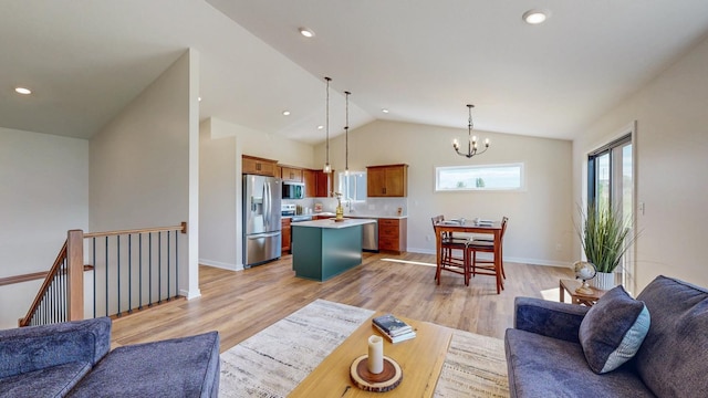 1483 Grand View Ln SE, Mazeppa, MN 55956 - living area featuring a chandelier, lofted ceiling, light wood finished floors, and recessed lighting