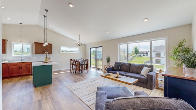 1483 Grand View Ln SE, Mazeppa, MN 55956 - living room featuring healthy amount of natural light, light wood-style floors, lofted ceiling, a chandelier, and recessed lighting