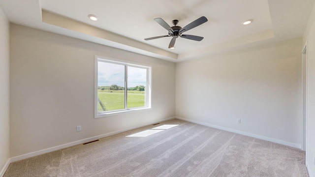 1483 Grand View Ln SE, Mazeppa, MN 55956 - unfurnished room featuring a raised ceiling, light carpet, ceiling fan, and recessed lighting