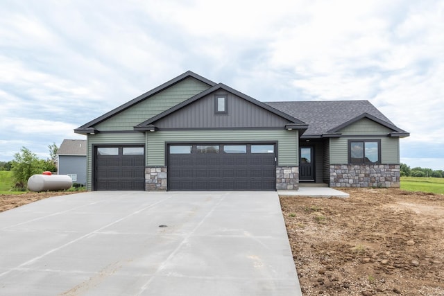 1483 Grand View Ln SE, Mazeppa, MN 55956 - craftsman-style home featuring stone siding, an attached garage, concrete driveway, and roof with shingles